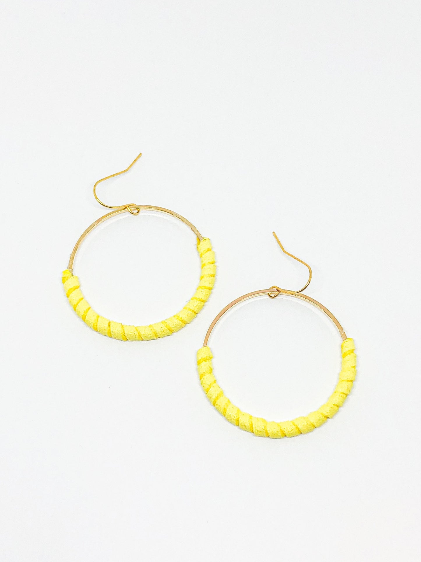 Gold hoop earrings with yellow faux suede