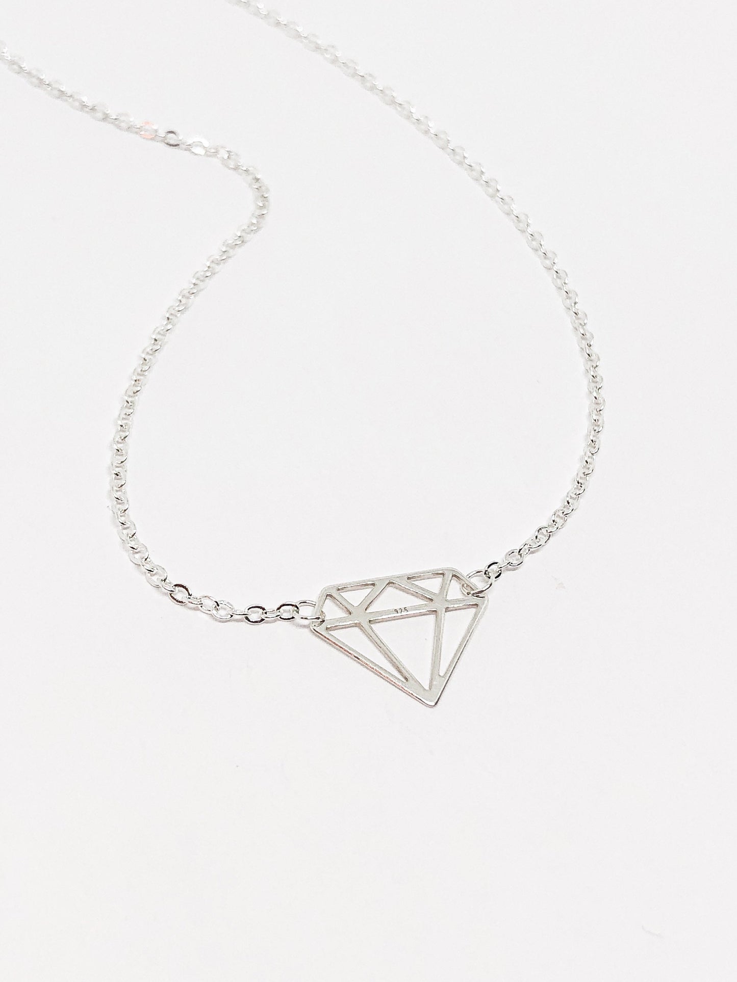 Diamond pendant in silver or gold