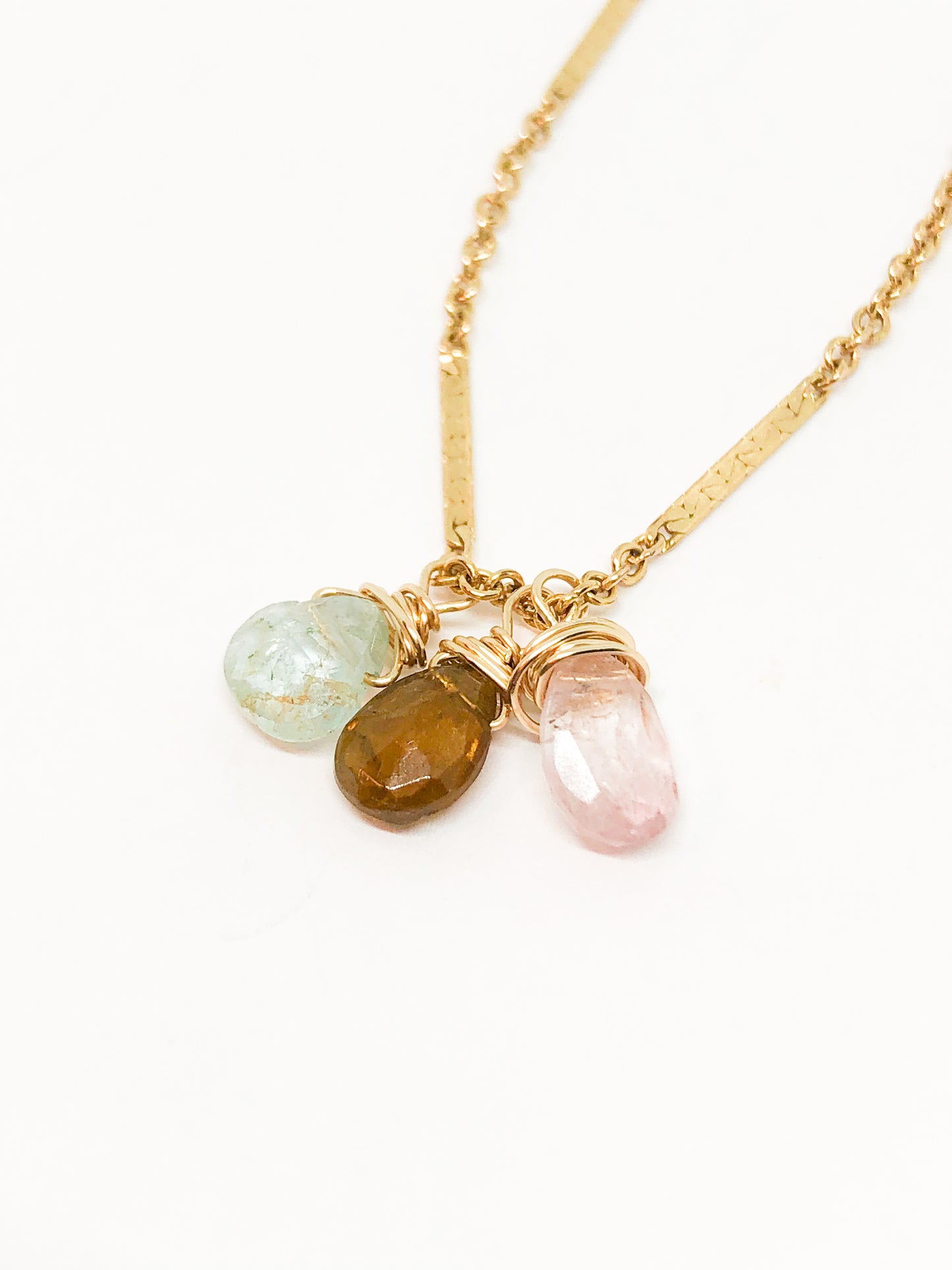 necklace in gold with aquamarine and tourmaline accents