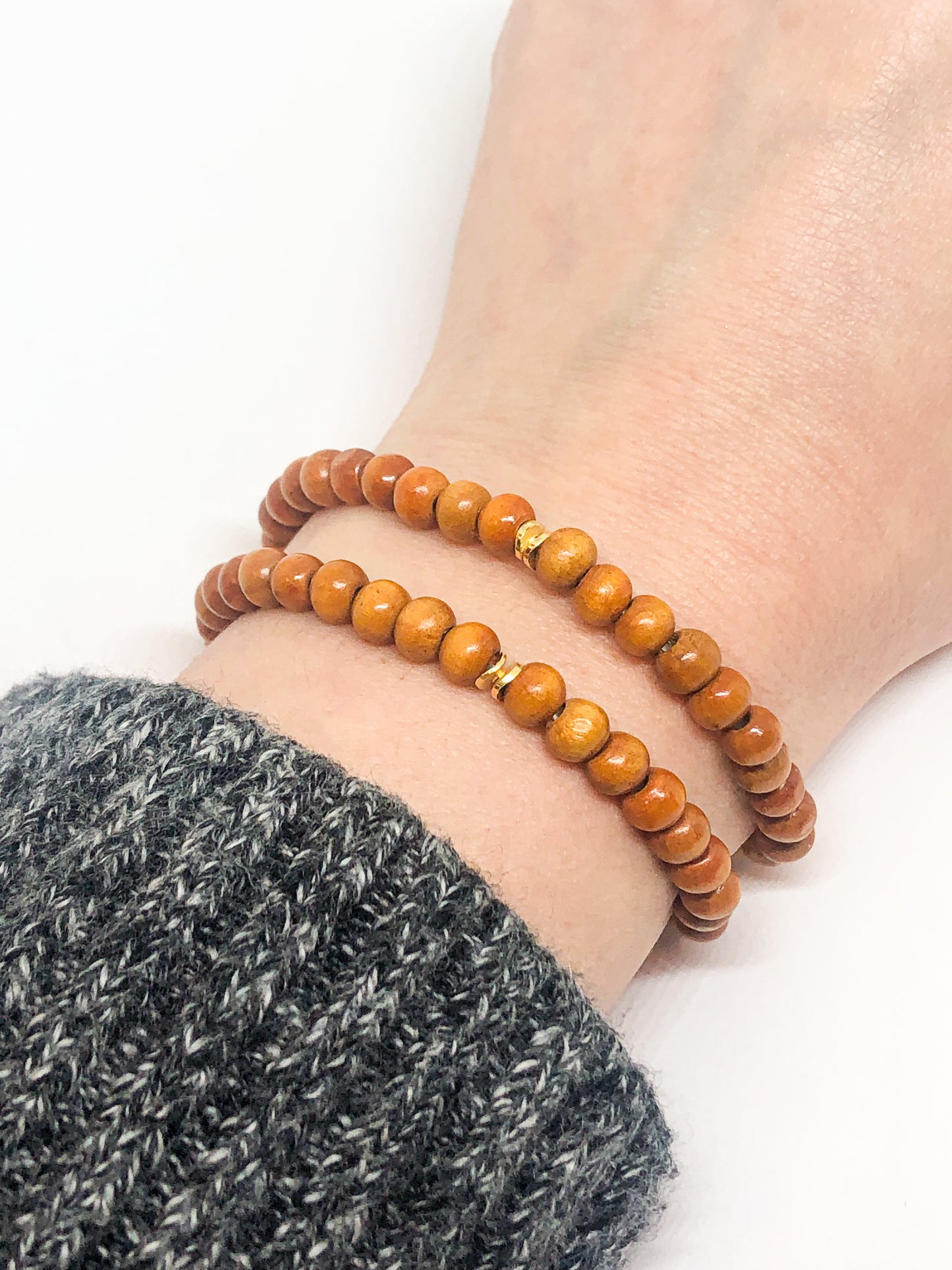 Wooden beaded bracelet with gold accent