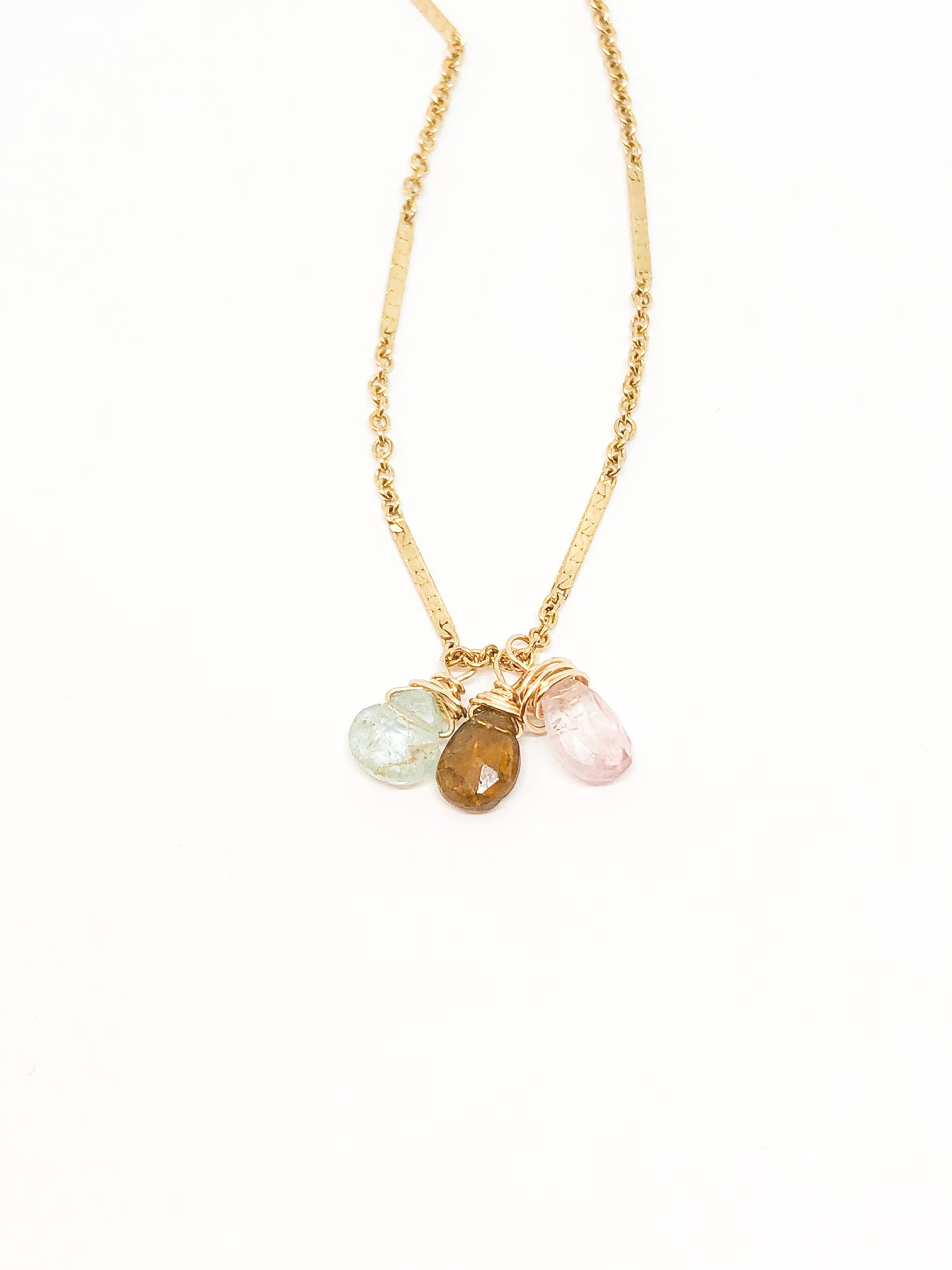 necklace in gold with aquamarine and tourmaline accents