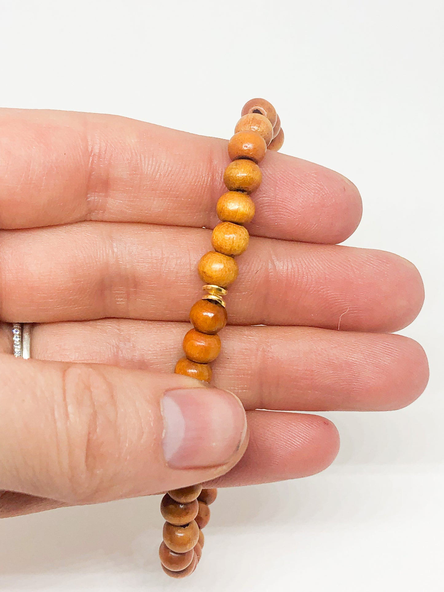 Wooden beaded bracelet with gold accent