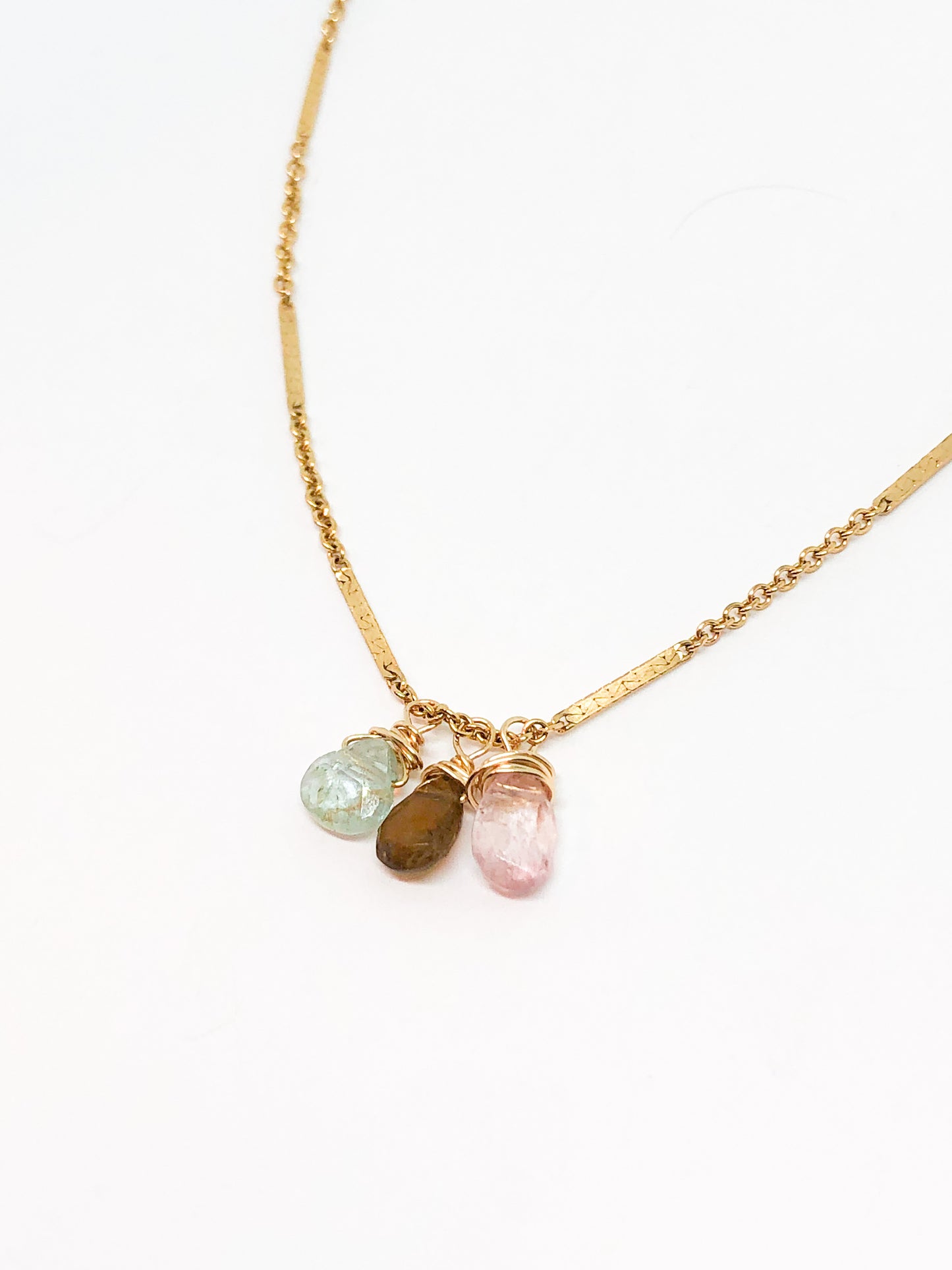 necklace in gold with aquamarine and tourmaline accents