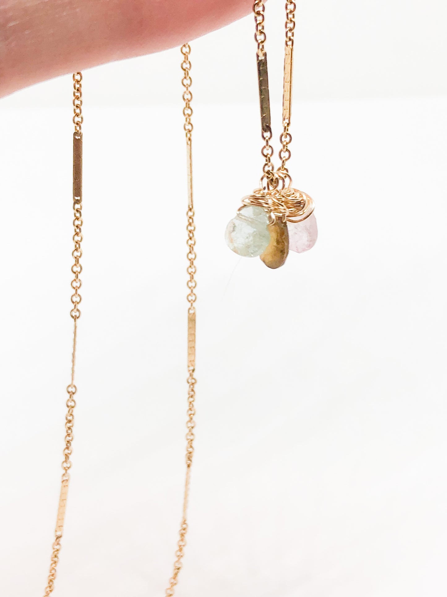 necklace in gold with aquamarine and tourmaline accents