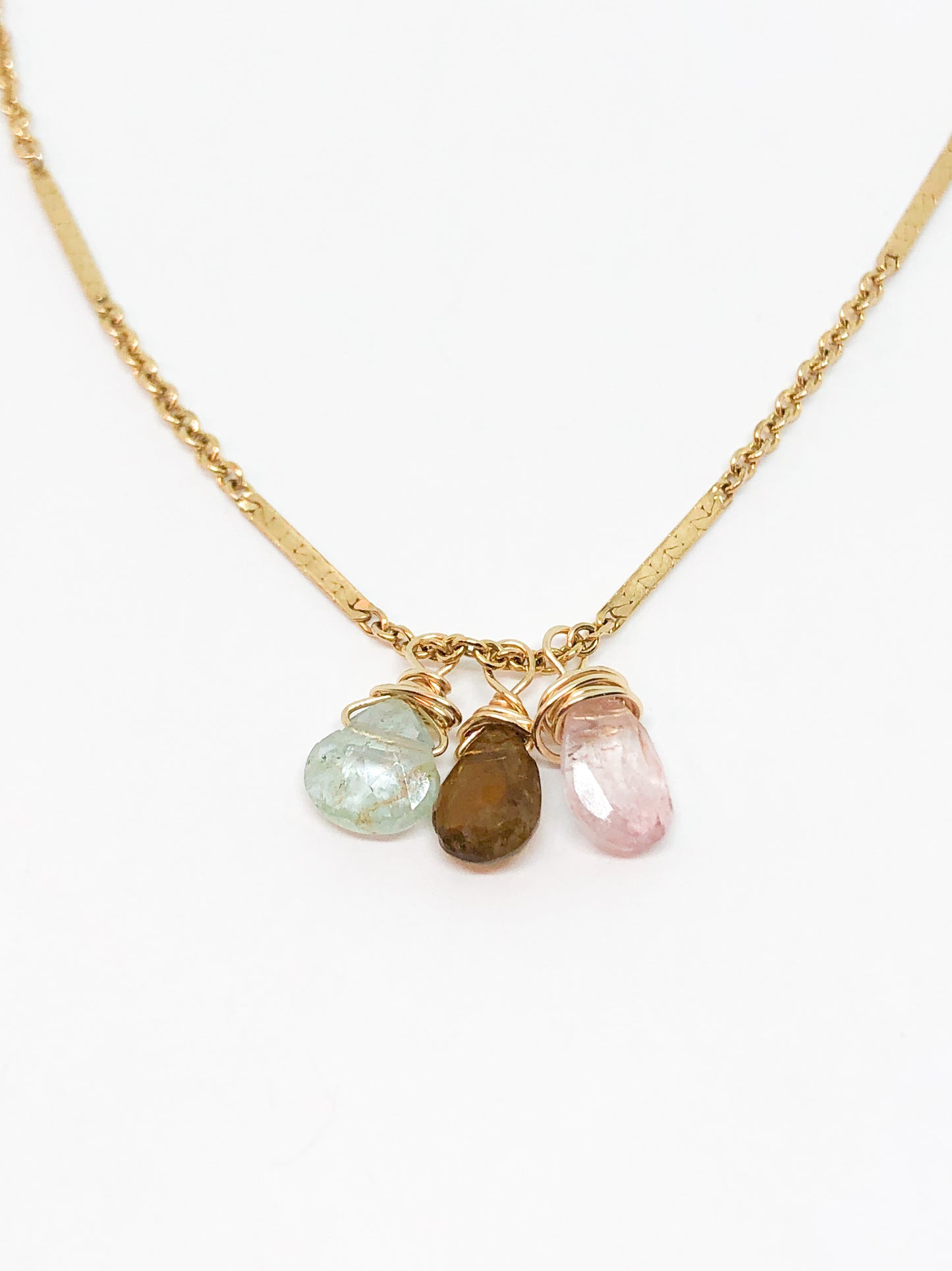 necklace in gold with aquamarine and tourmaline accents